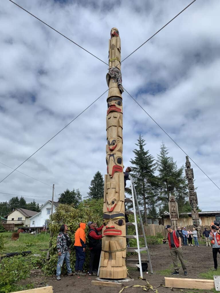 The Kadashan Totem Pole 
The current Eagle Kadashan Pole is the fourth iteration and a replica of the version carved in 1940. Its origins trace back to the early 1800s, when Haida relatives gifted Chief Kadashan, a Kaasx̱ʼagweidí clan leader, a five-foot carved wooden staff to honor the intermarriages between Haida men and Tlingit women. A few years later, Kadashan raised a totem pole depicting the staff, marking the creation of the first Kadashan Pole in the 1830s. It originally stood near the present-day site of Trident Seafoods in Wrangell.

This totem pole stands as a powerful symbol of repatriation, and enduring ties between Wrangell Tlingit community and Haida people. 

Haida master carver TJ Young carved the Kadashan totem pole. A team of apprentices supported TJ Young including Mike Hoyt, Tony Harding and Linda Churchill, Susie Byford and Jerry Knapp. It raised in July 2025.

